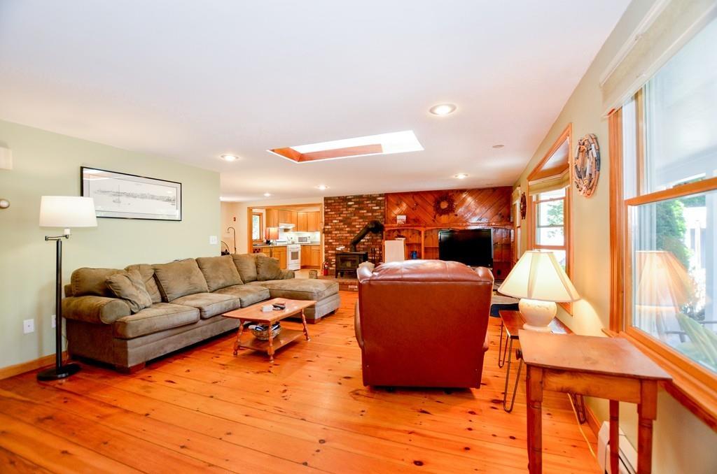 899 Walnut Plain Road Rochester, MA 02770 - Photo 20 of 42 a living room with furniture and a large window