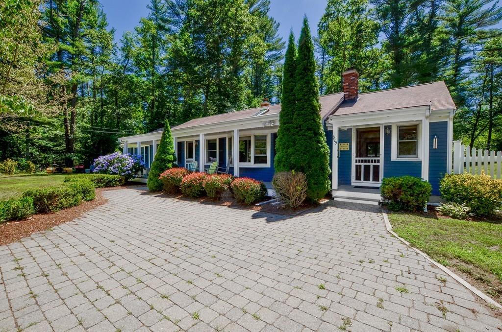 899 Walnut Plain Road Rochester, MA 02770 - Photo 2 of 42 a view of a house with backyard sitting area and garden