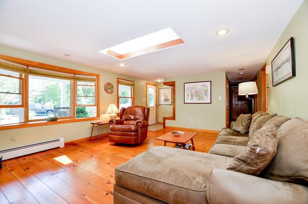 899 Walnut Plain Road Rochester, MA 02770 - Photo 21 of 42 a living room with furniture and a large window