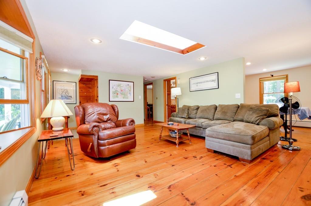 899 Walnut Plain Road Rochester, MA 02770 - Photo 23 of 42 a living room with furniture or couch and a large window