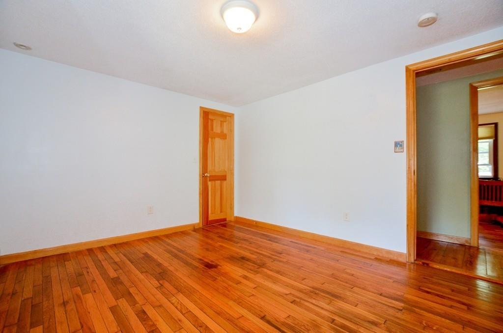 899 Walnut Plain Road Rochester, MA 02770 - Photo 28 of 42 a view of an empty room and wooden floor