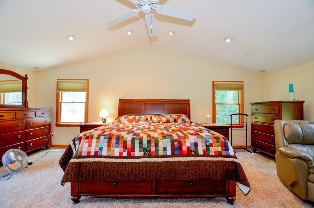899 Walnut Plain Road Rochester, MA 02770 - Photo 30 of 42 a bedroom with a bed and dresser