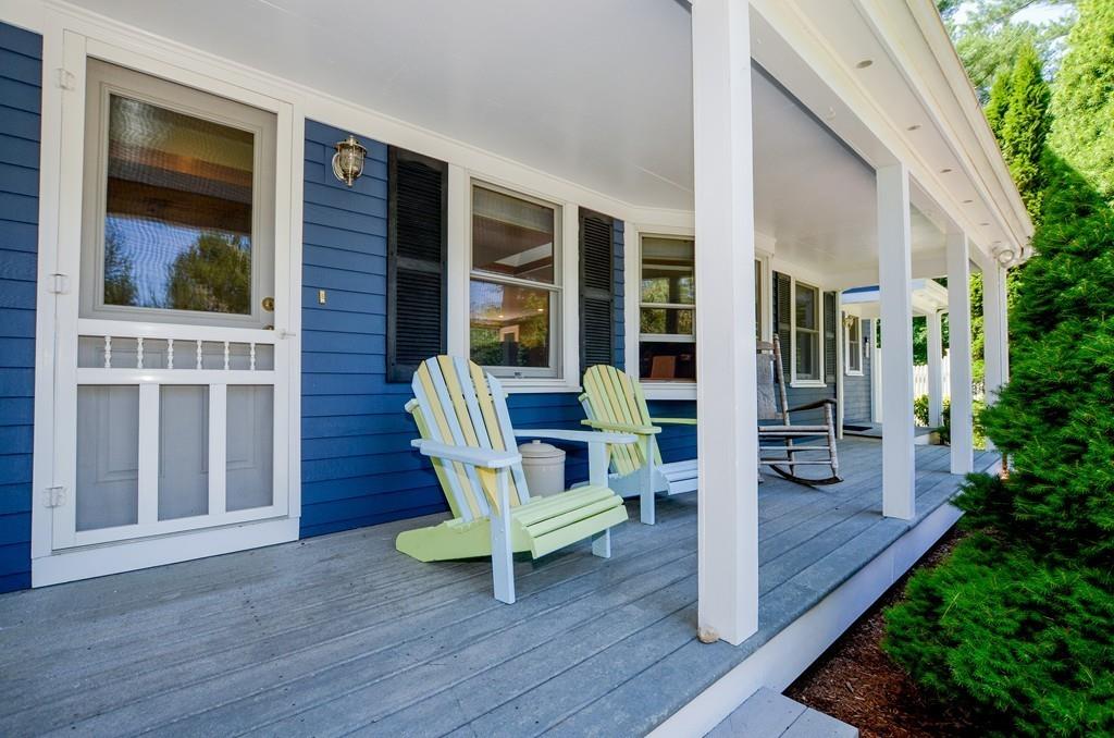 899 Walnut Plain Road Rochester, MA 02770 - Photo 3 of 42 a view of a deck with table and chairs and wooden floor