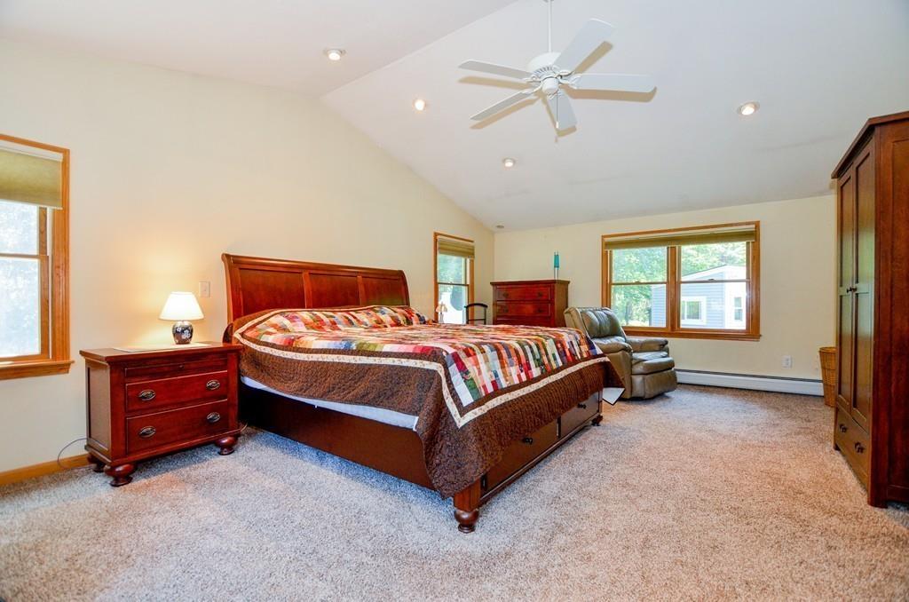 899 Walnut Plain Road Rochester, MA 02770 - Photo 31 of 42 a spacious bedroom with a bed and window