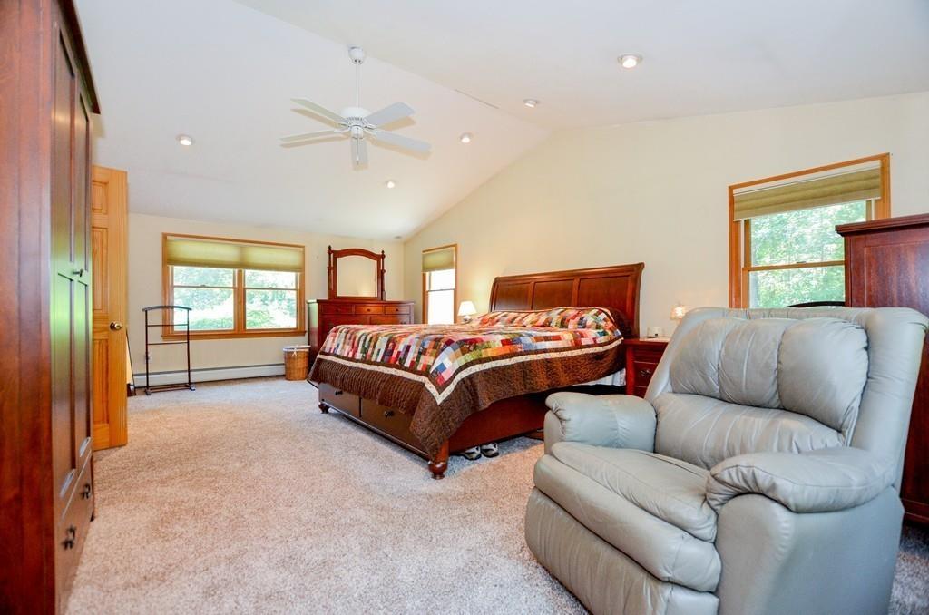 899 Walnut Plain Road Rochester, MA 02770 - Photo 32 of 42 a bedroom with a bed couch and window