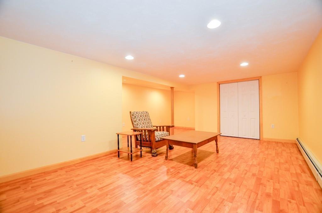 899 Walnut Plain Road Rochester, MA 02770 - Photo 33 of 42 a view of a room with wooden floor windows and chairs