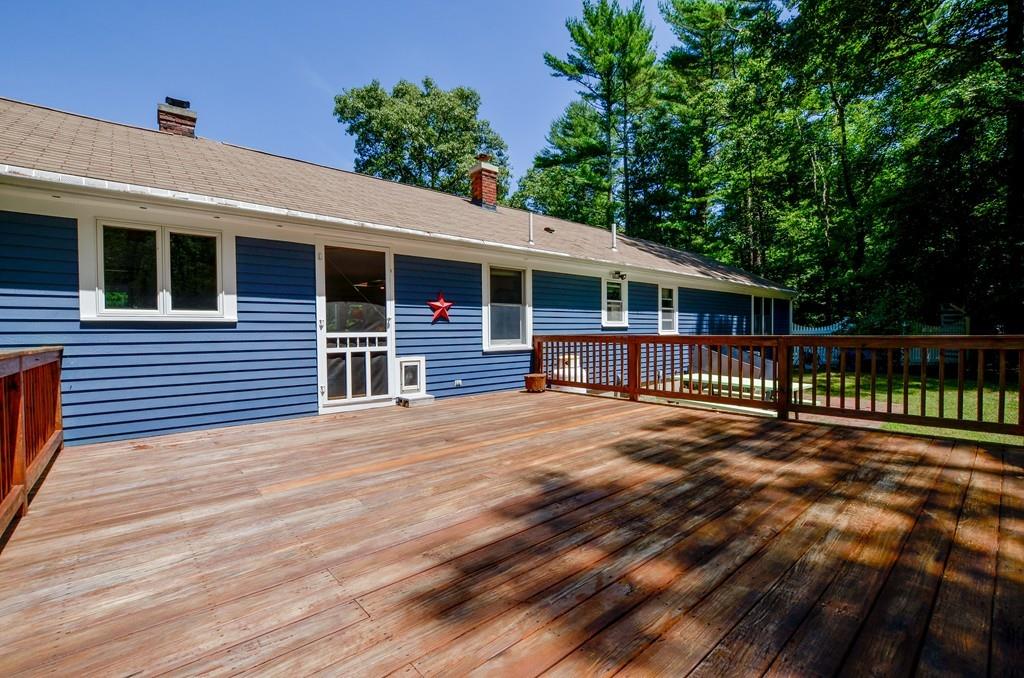 899 Walnut Plain Road Rochester, MA 02770 - Photo 9 of 42 a view of backyard with deck and wooden floor