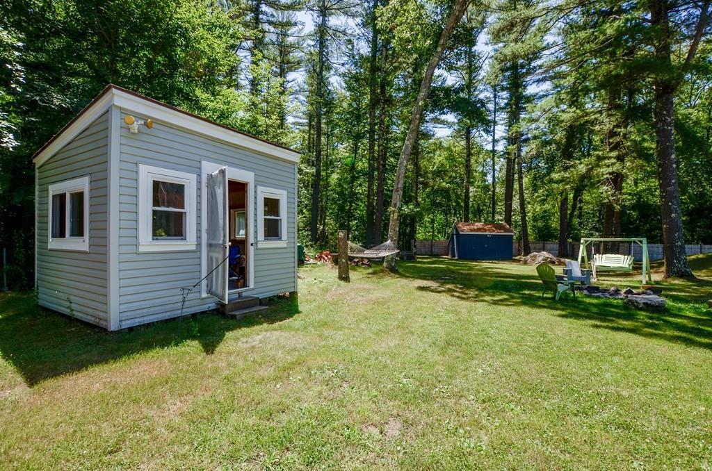 899 Walnut Plain Road Rochester, MA 02770 - Photo 10 of 42 a view of a backyard with a garden