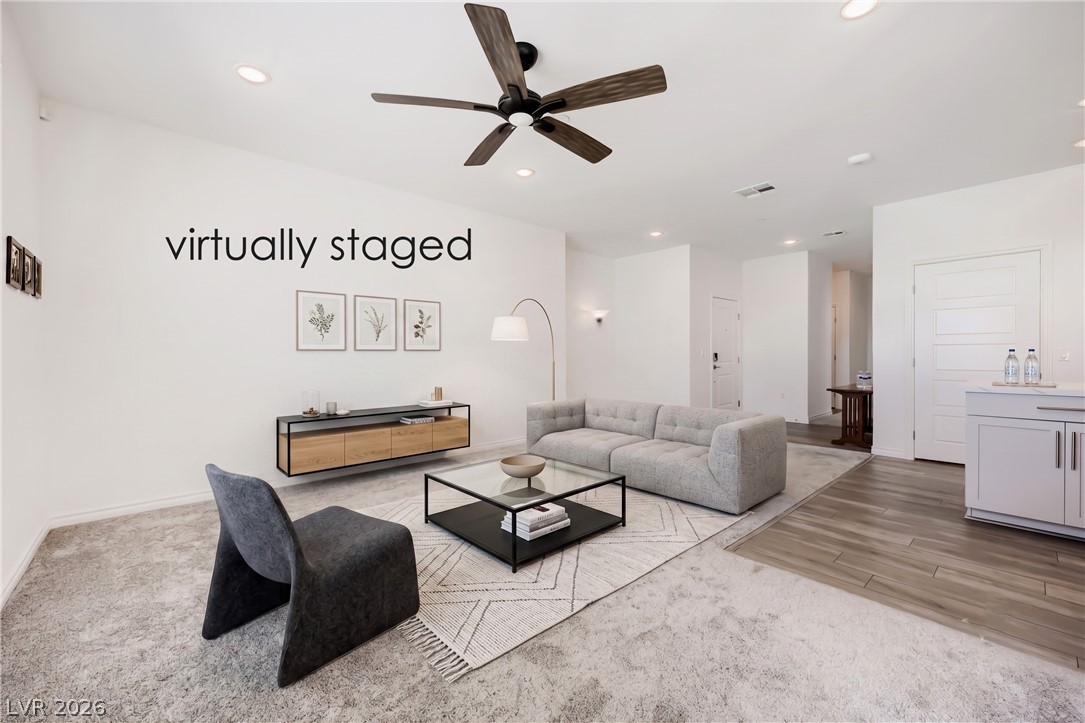 2555 Hampton Road, Unit 9301 Henderson, NV 89052 - Photo 11 of 36 Recessed lighting illuminates this inviting living area featuring mixed flooring and a ceiling fan.