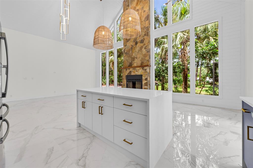 15184 Alexander Run Jupiter, FL 33478 - Photo 18 of 46 a bathroom with a sink a mirror and a window