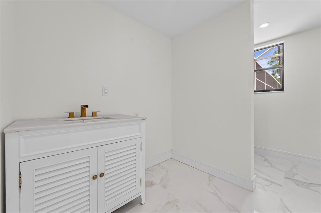 15184 Alexander Run Jupiter, FL 33478 - Photo 21 of 46 a utility room with a sink