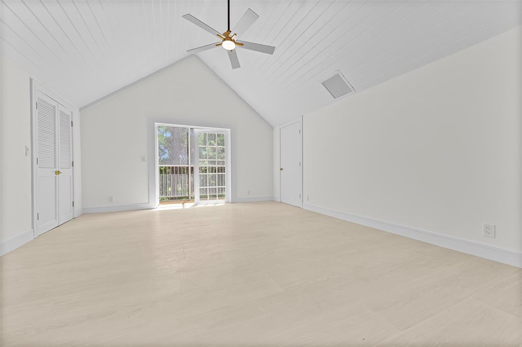 15184 Alexander Run Jupiter, FL 33478 - Photo 30 of 46 en empty room with windows and ceiling fan