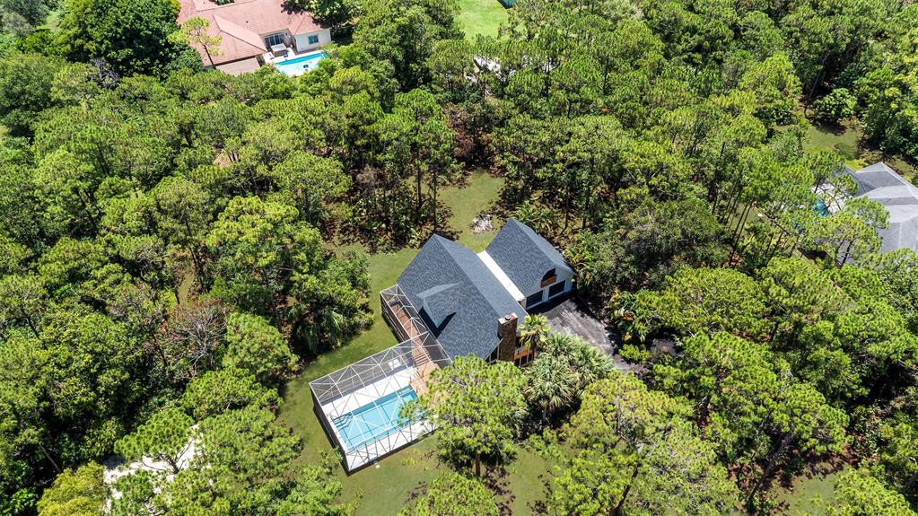 15184 Alexander Run Jupiter, FL 33478 - Photo 3 of 46 an aerial view of houses with yard