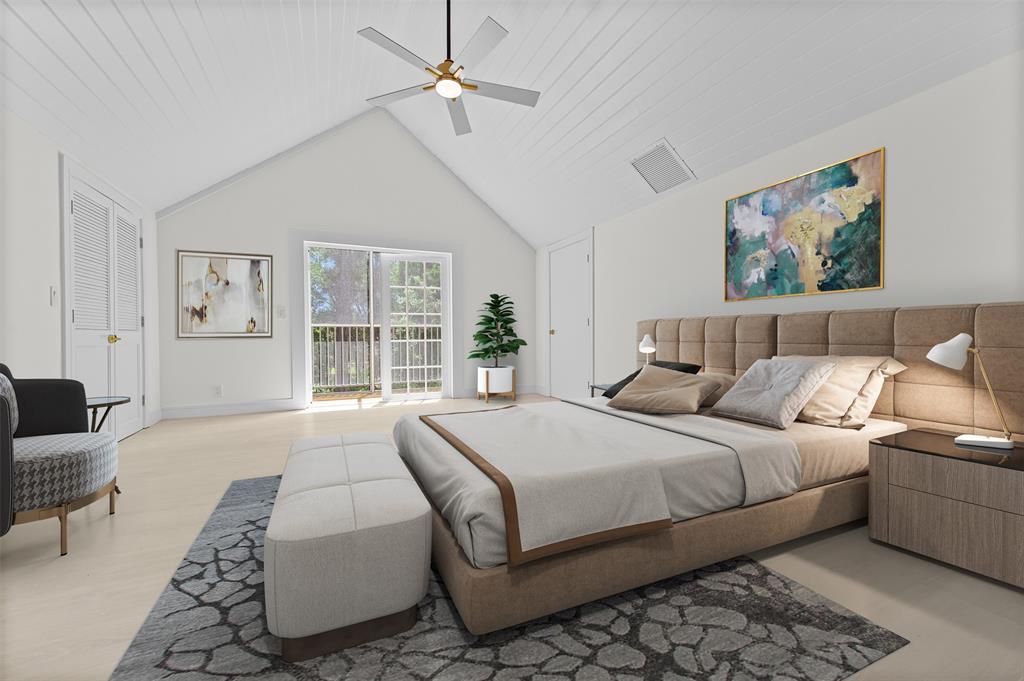 15184 Alexander Run Jupiter, FL 33478 - Photo 31 of 46 a bedroom with a large bed couch and a window