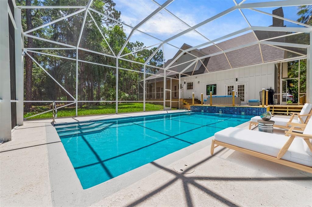 15184 Alexander Run Jupiter, FL 33478 - Photo 38 of 46 a view of a backyard with sitting area