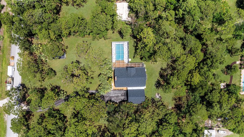 15184 Alexander Run Jupiter, FL 33478 - Photo 4 of 46 a view of a house with a yard