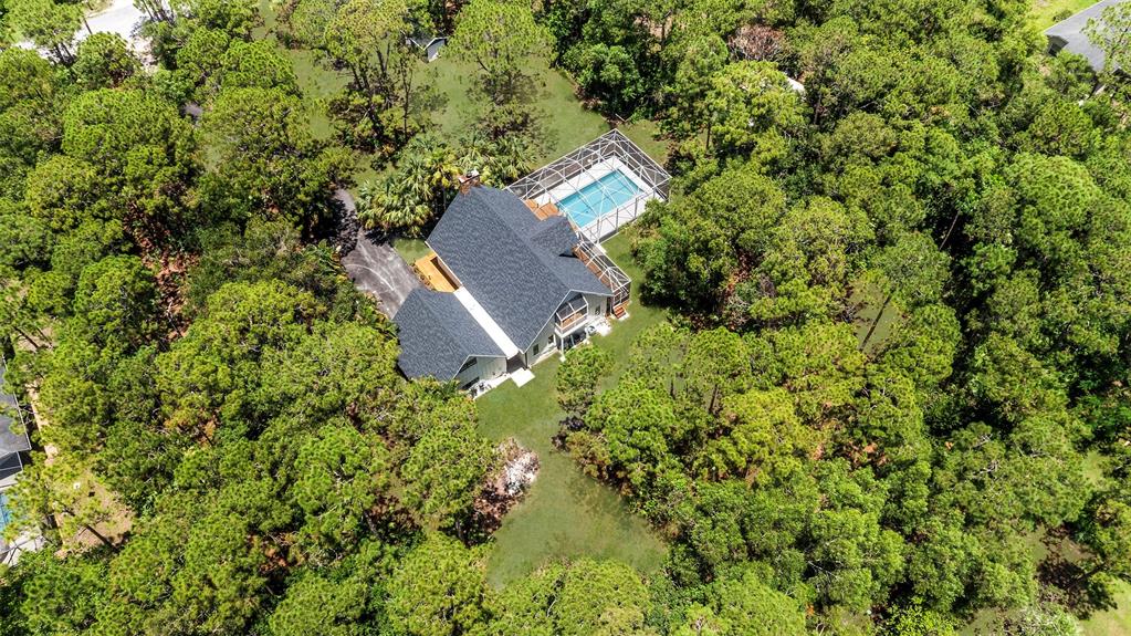 15184 Alexander Run Jupiter, FL 33478 - Photo 5 of 46 an aerial view of a house with a yard
