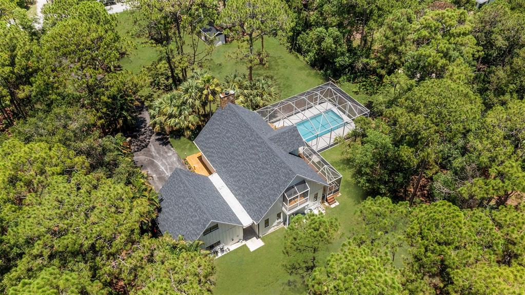 15184 Alexander Run Jupiter, FL 33478 - Photo 7 of 46 an aerial view of a house with a yard