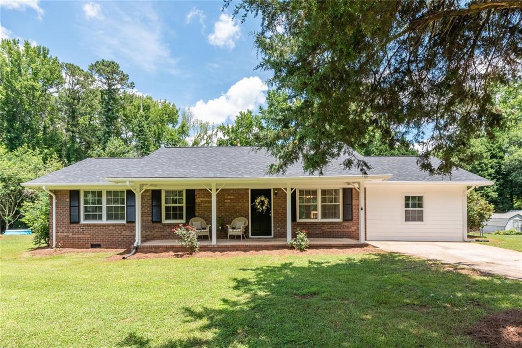 603 Dallas Road Dallas, GA 30157 - Photo 1 of 1 a view of a house with a backyard porch and sitting area