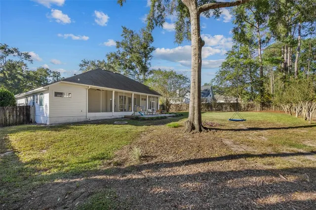 a house with trees in the background