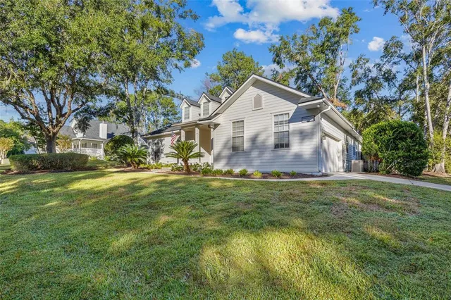 a front view of house with yard and green space