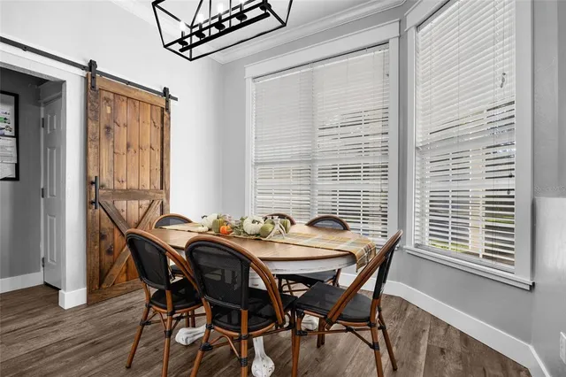 a dining room with furniture and window