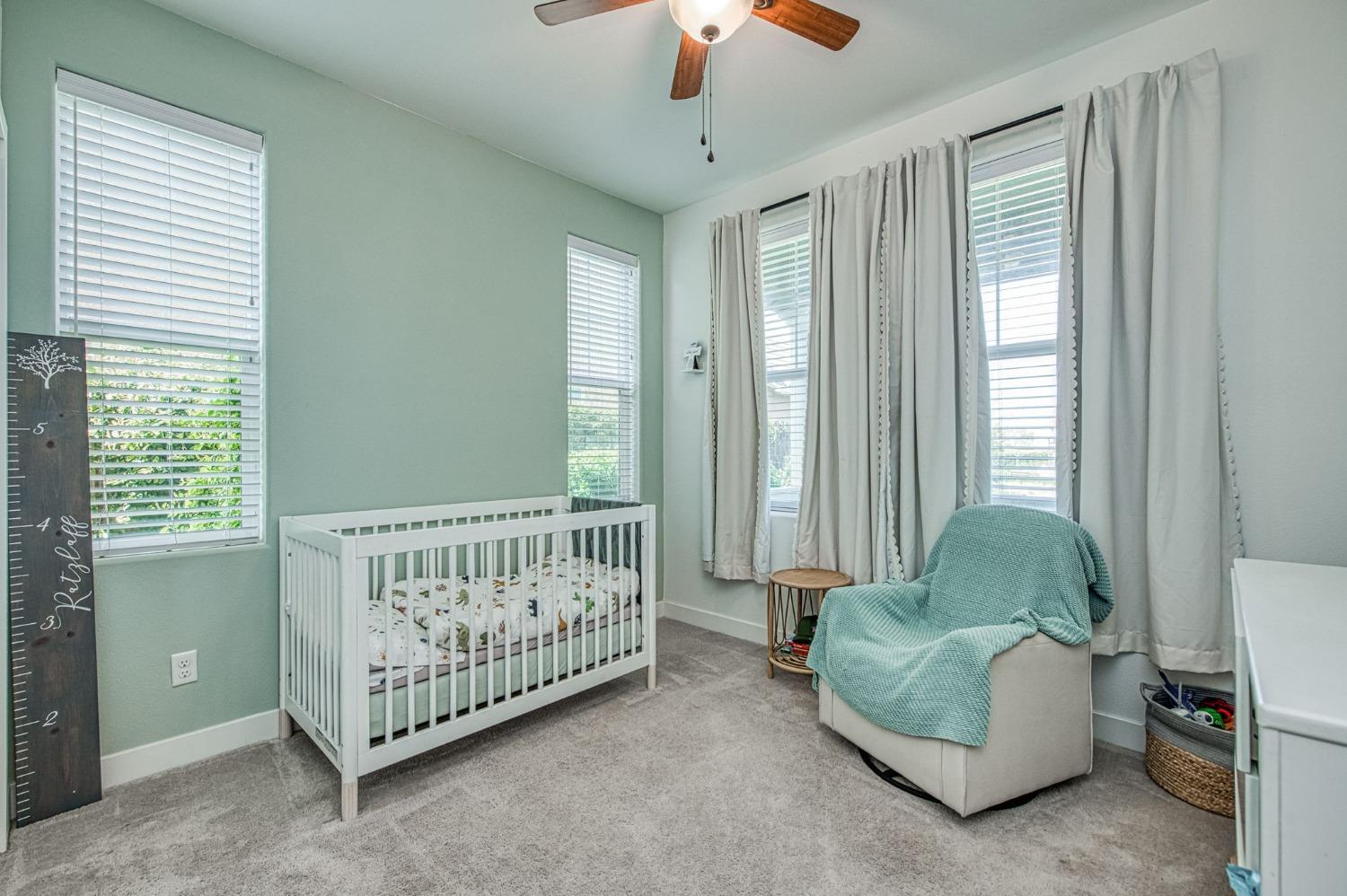 408 Grant Avenue West Madera, CA 93636 - Photo 19 of 42 a bedroom with furniture and windows