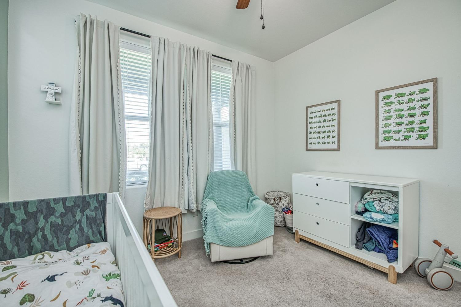 408 Grant Avenue West Madera, CA 93636 - Photo 20 of 42 a bedroom with a bed and a window