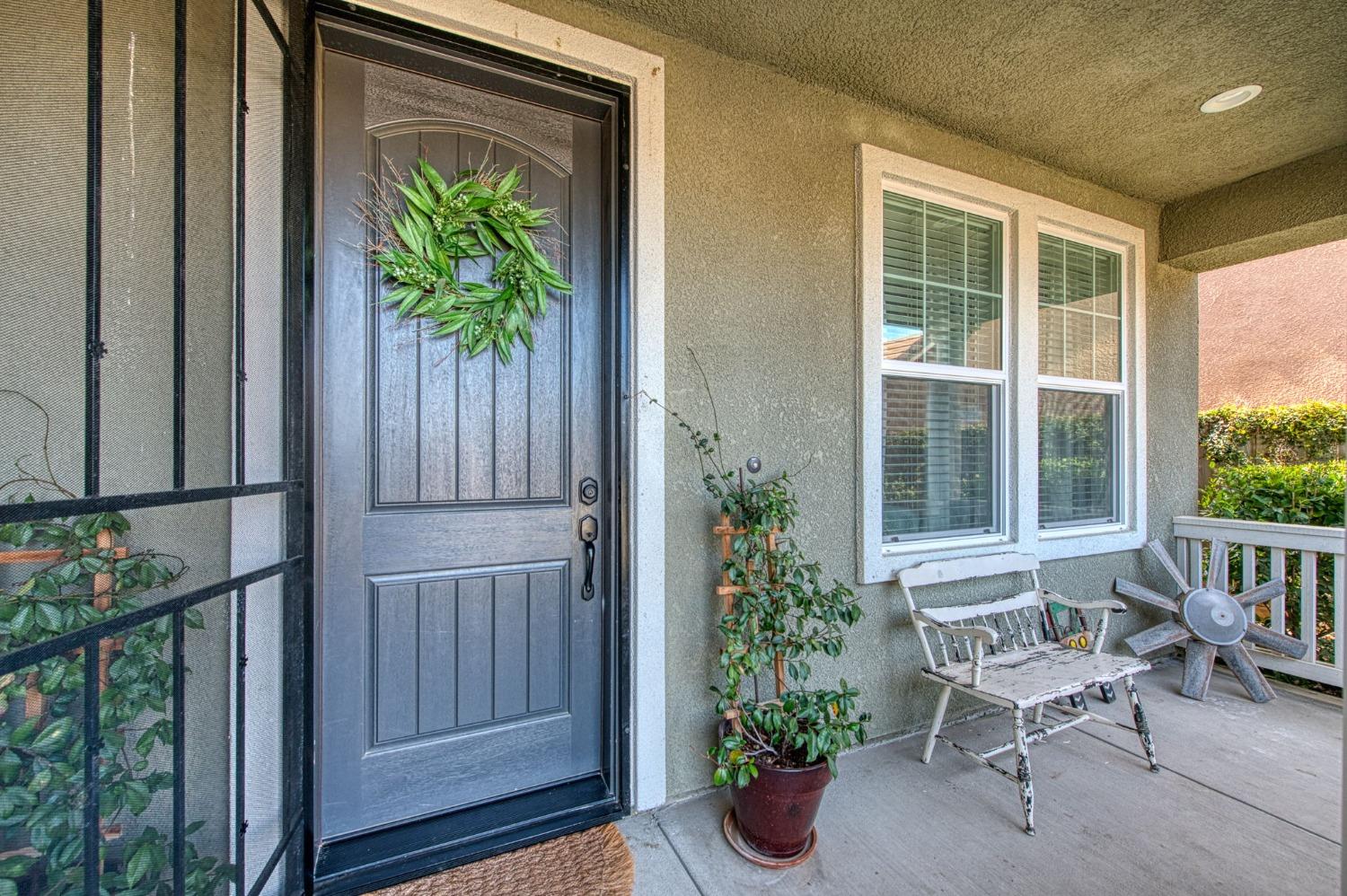 408 Grant Avenue West Madera, CA 93636 - Photo 2 of 42 a view of a balcony with chair and potted plants