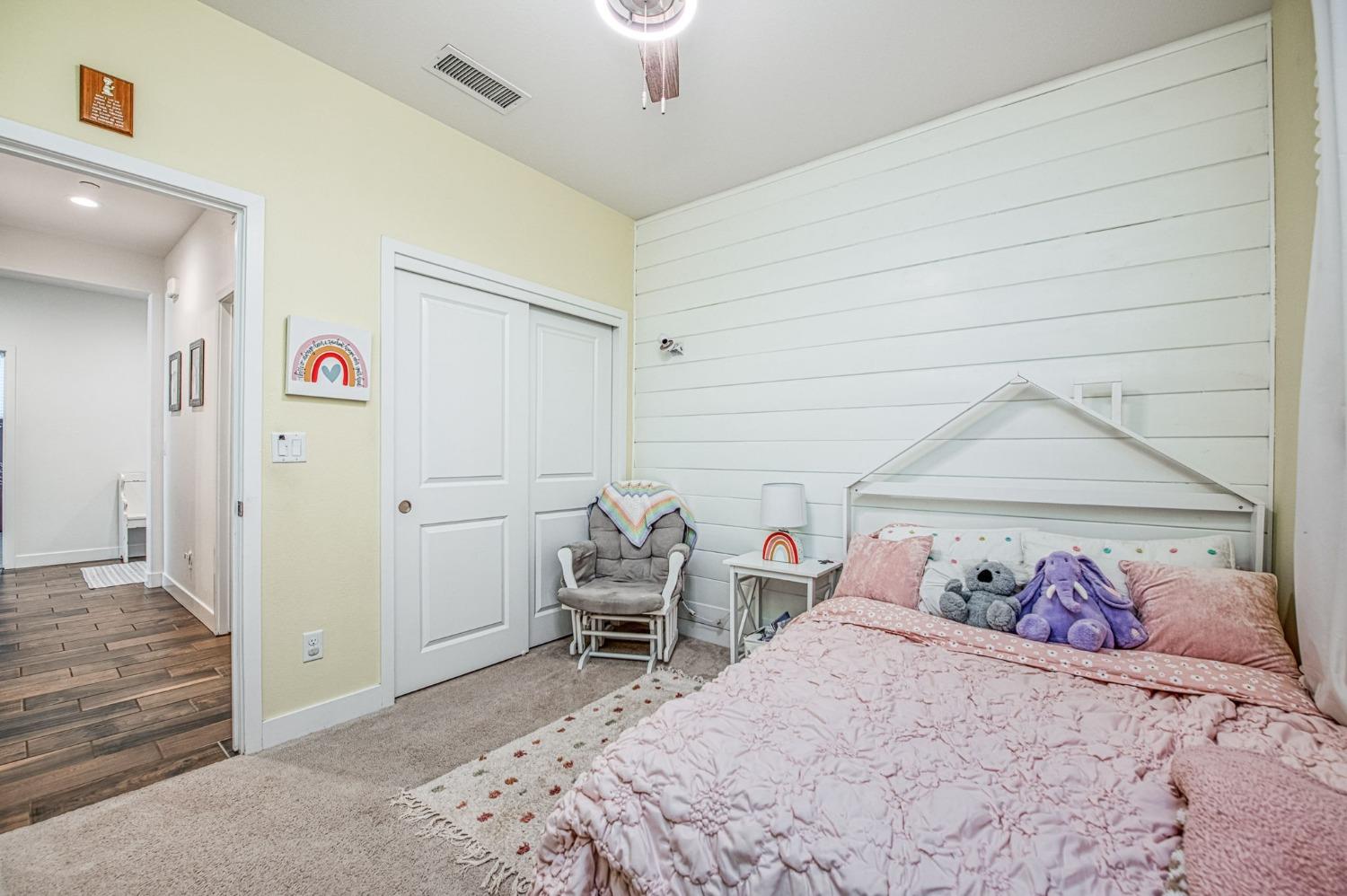 408 Grant Avenue West Madera, CA 93636 - Photo 22 of 42 a bedroom with a bed and a table