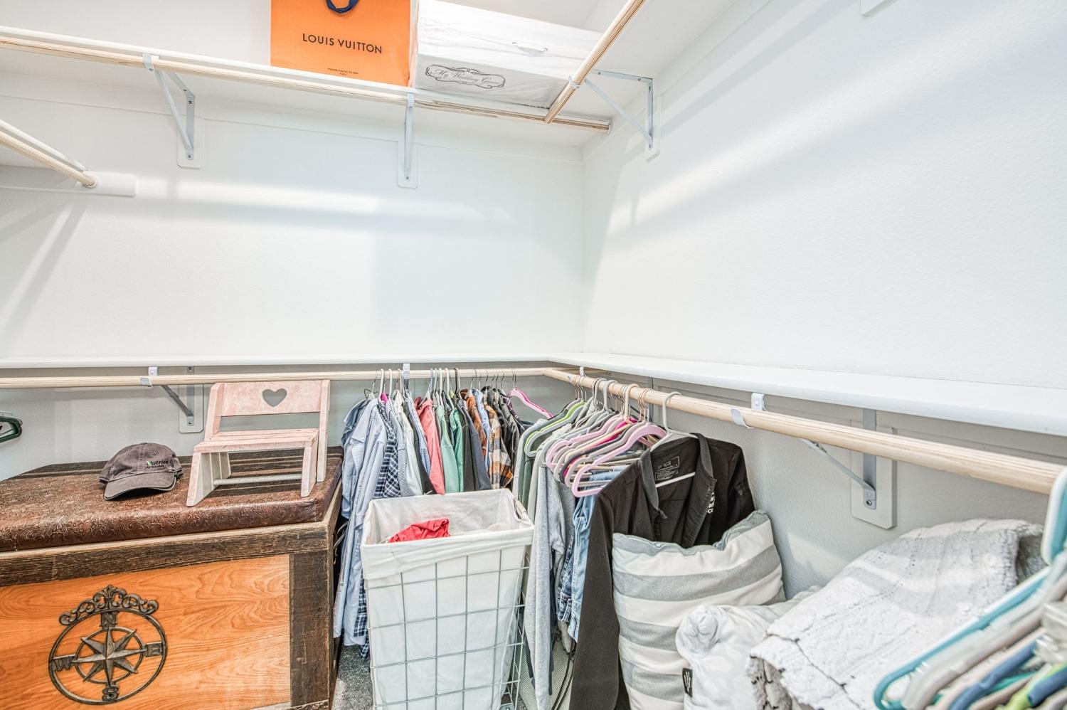 408 Grant Avenue West Madera, CA 93636 - Photo 27 of 42 a view of walk in closet with clothes and shoes