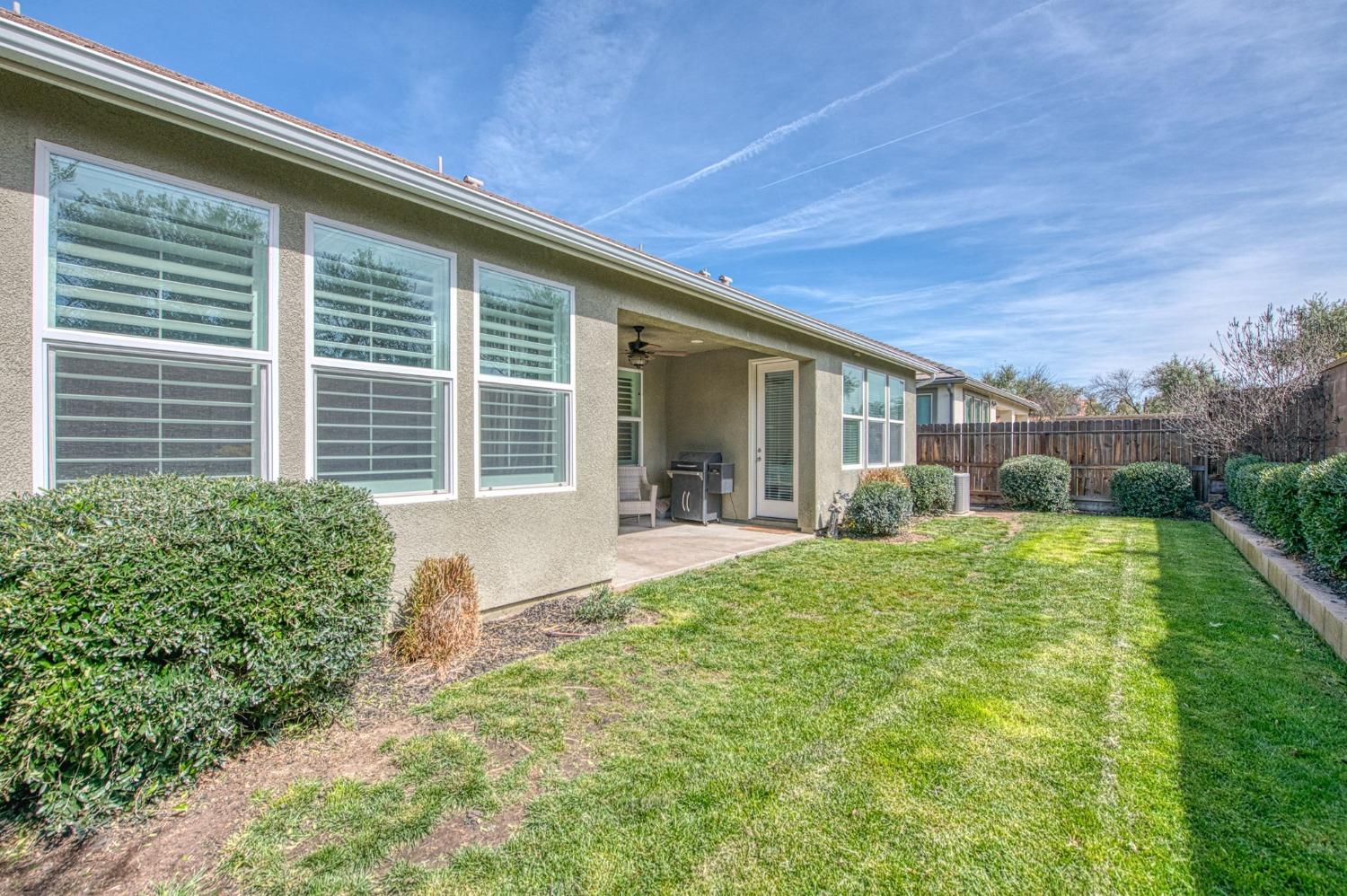 408 Grant Avenue West Madera, CA 93636 - Photo 30 of 42 a view of house with backyard porch and outdoor seating