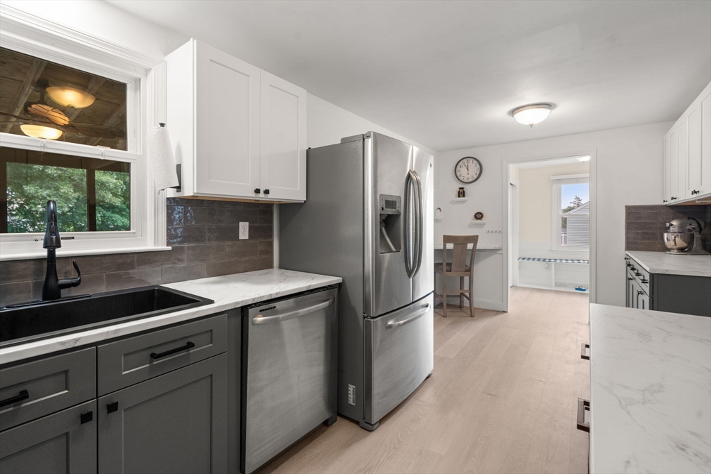 9 Laurel Lane Bellingham, MA 02019 - Photo 9 of 30 a kitchen with a refrigerator and a sink