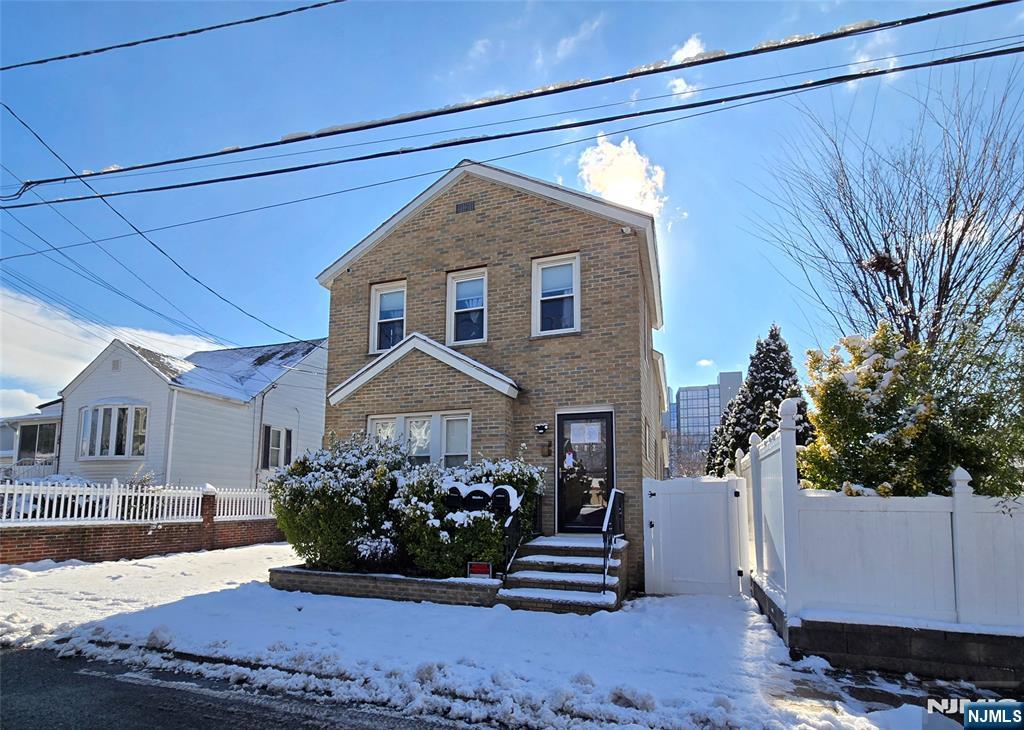 282 Harding Avenue, Unit 2 Teaneck, NJ 07666 - Photo 17 of 17 a front view of a house with garden