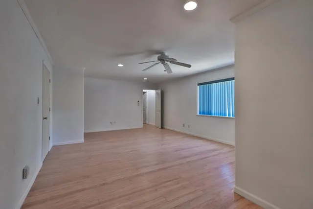 a view of an empty room with a window