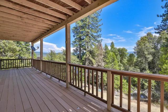 a view of balcony with wooden floor