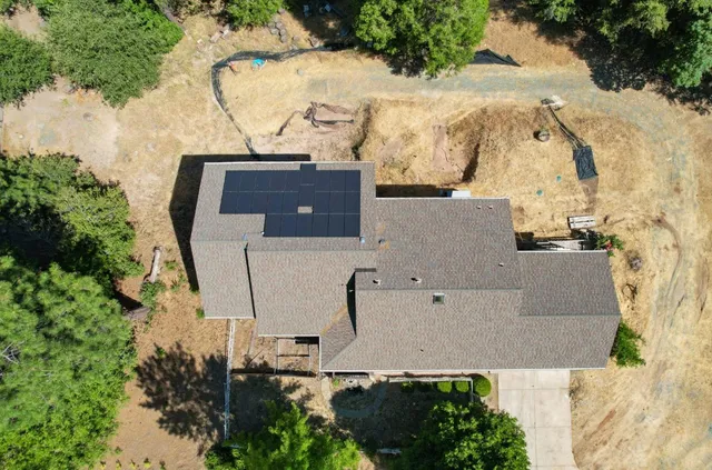 an aerial view of residential house with outdoor space