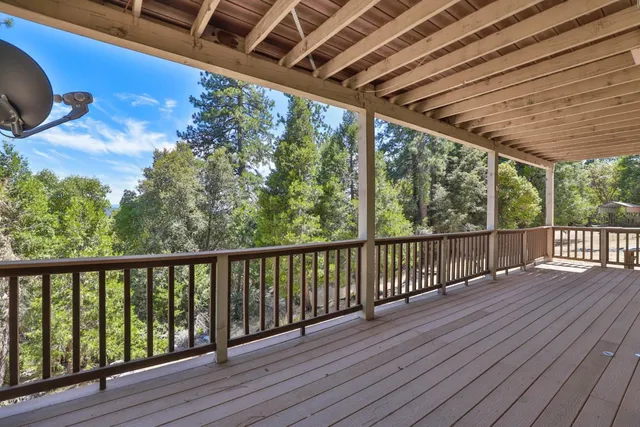 a view of porch with wooden floor