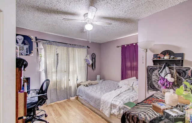 a bathroom with a sink vanity mirror and toilet