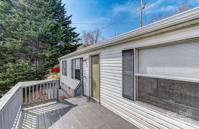 a view of a balcony with wooden floor