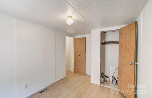 a view of a pathway of a building with wooden floor