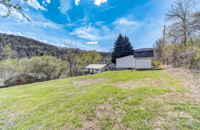 an aerial view of a house with outdoor space