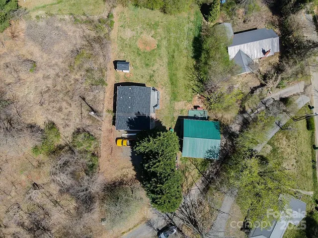 an aerial view of a house with mountain view