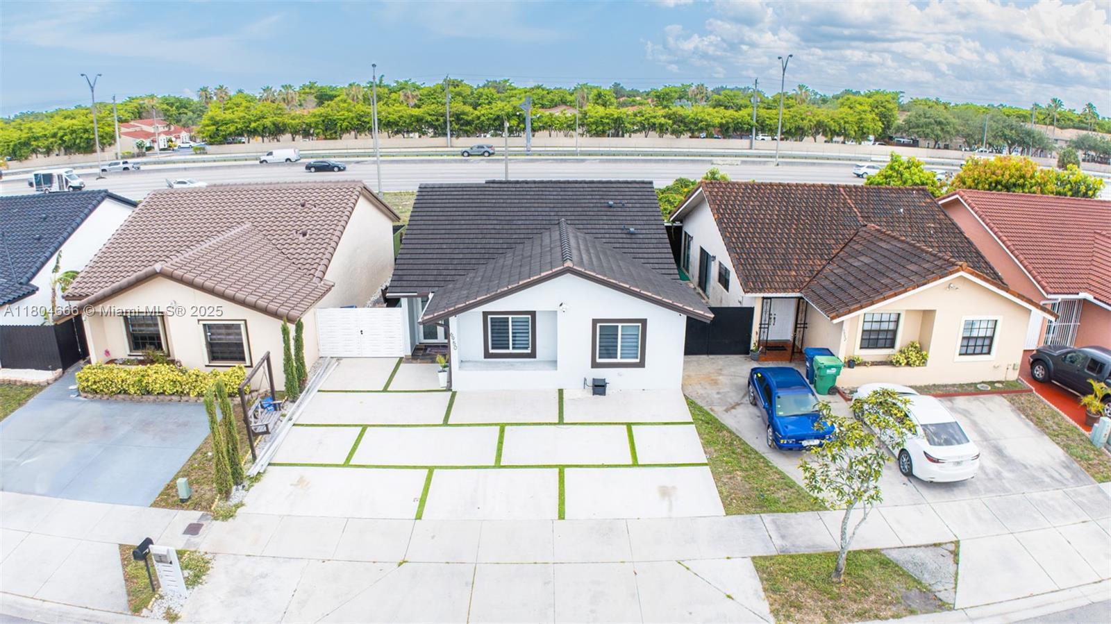 a view of multiple houses with a yard
