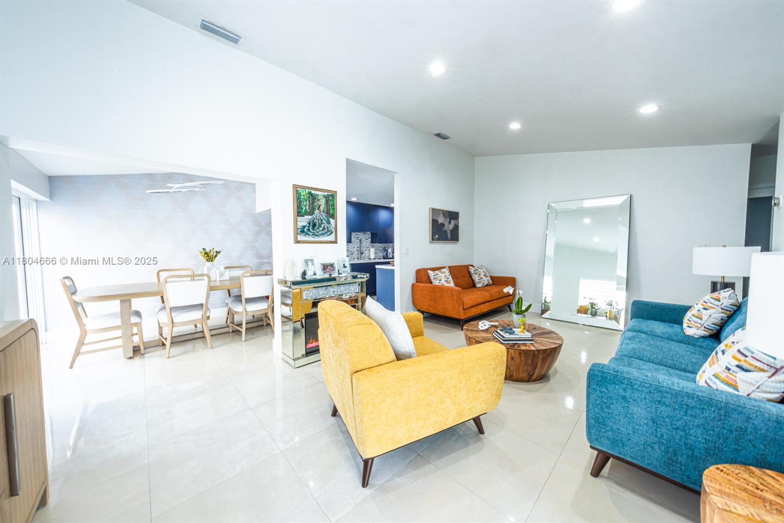 6950 Northwest 168th Street Hialeah, FL 33015 - Photo 11 of 28 a living room with furniture and a large window