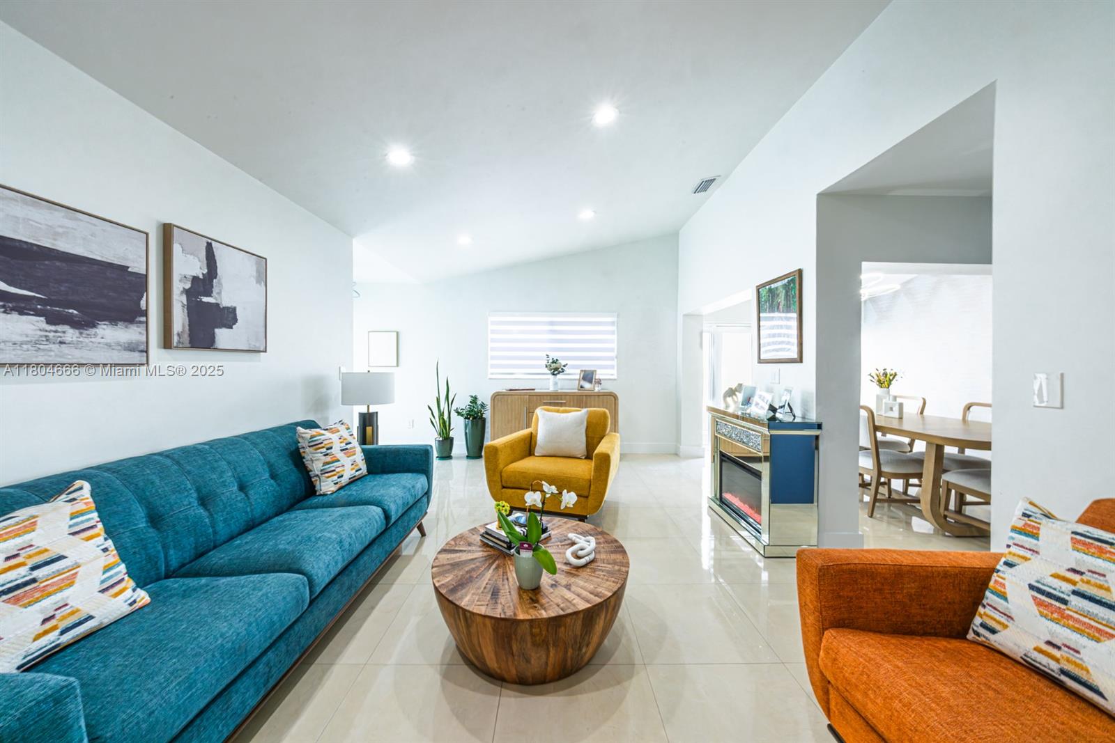 6950 Northwest 168th Street Hialeah, FL 33015 - Photo 12 of 28 a living room with furniture and a view of kitchen