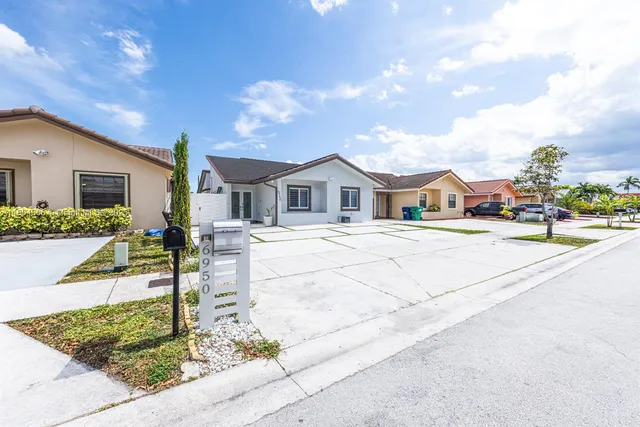 a house with yard in front of it