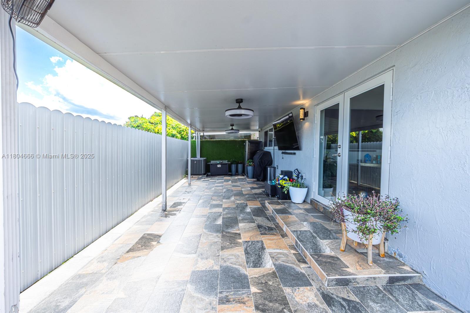 6950 Northwest 168th Street Hialeah, FL 33015 - Photo 9 of 28 a view of a house with potted plants