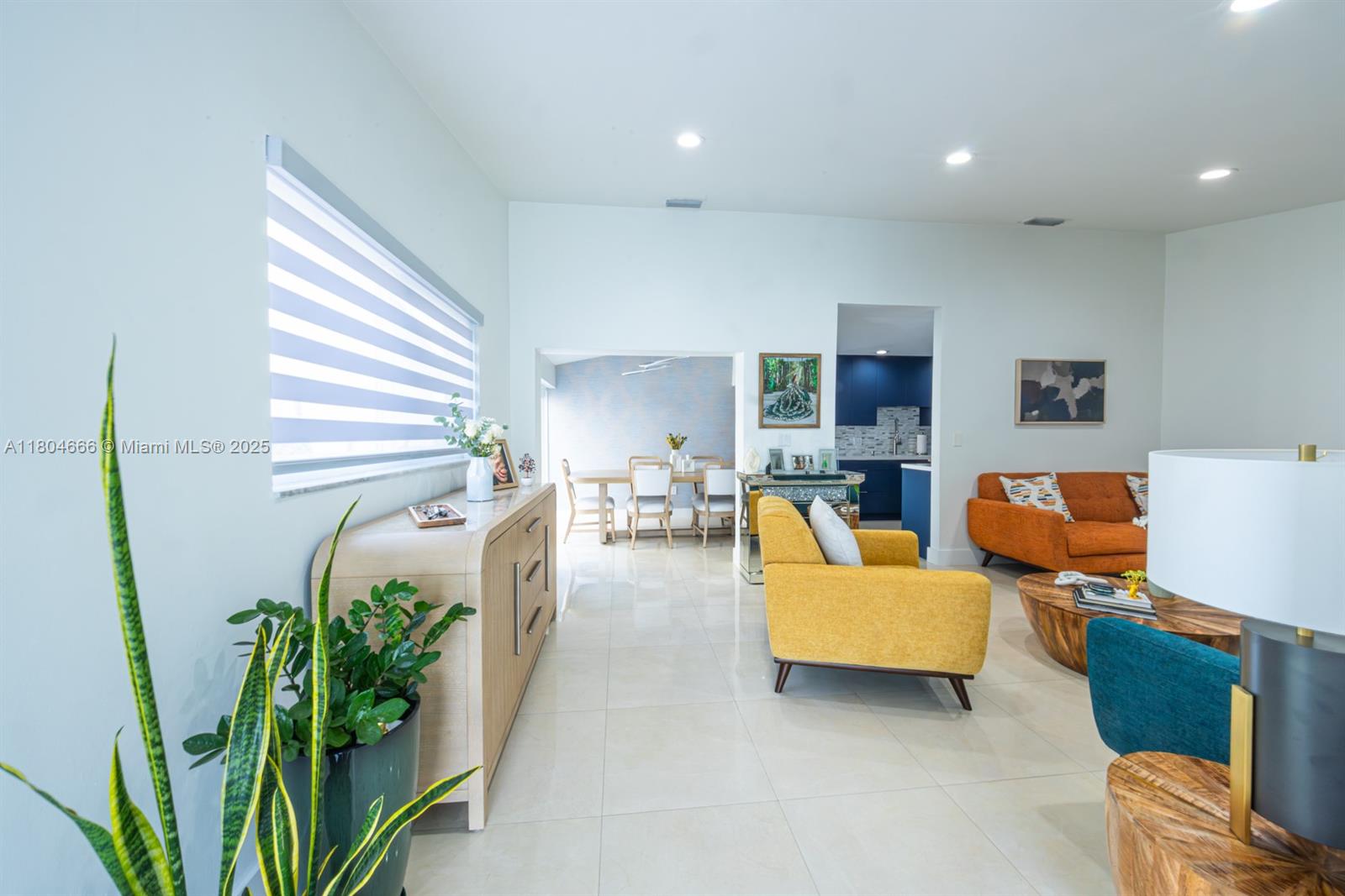 6950 Northwest 168th Street Hialeah, FL 33015 - Photo 10 of 28 a living room with furniture and a potted plant