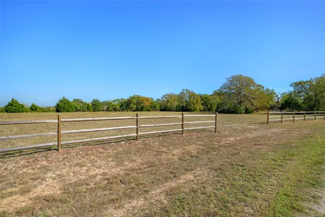 a view of lake with green space